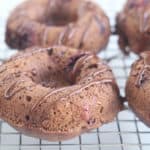baked-cocoa-donuts on wire rack