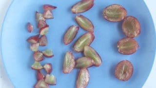 cut-up-grapes-for-babies-on-blue-plate