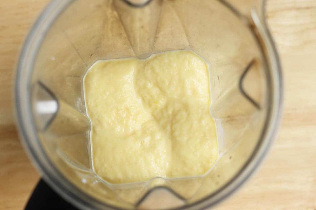 blended mango popsicle ingredients in blender
