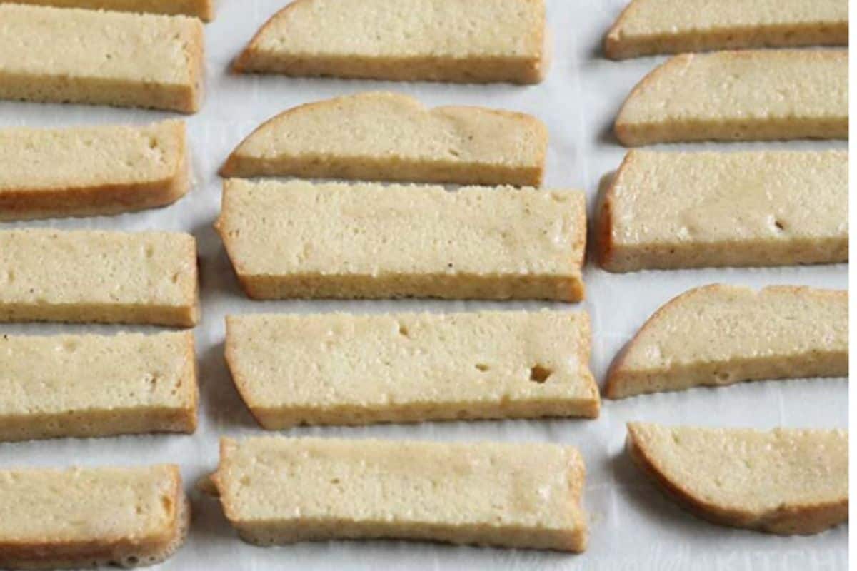 French toast sticks on baking pan before baking.