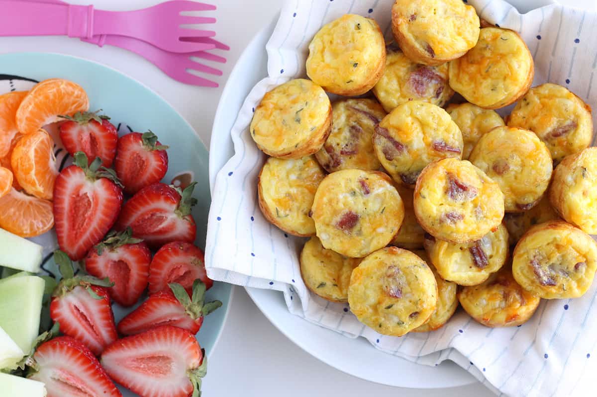 bacon-and-egg-muffins-in-bowl-next-to-fruit