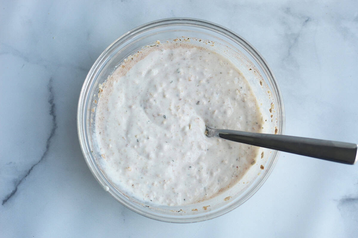 ingredients for overnight oats with yogurt mixed in bowl.
