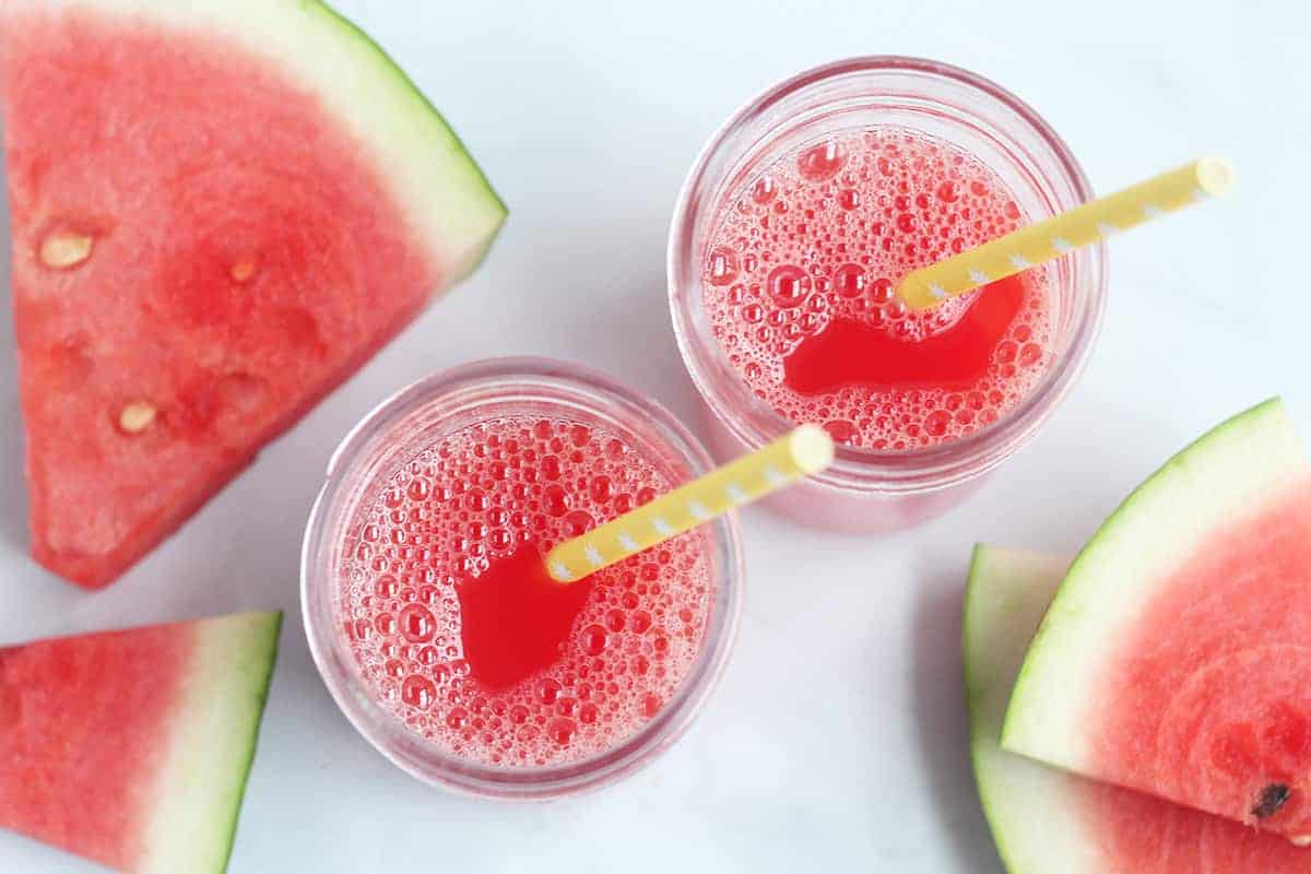 watermelon juice in jars with yellow straws