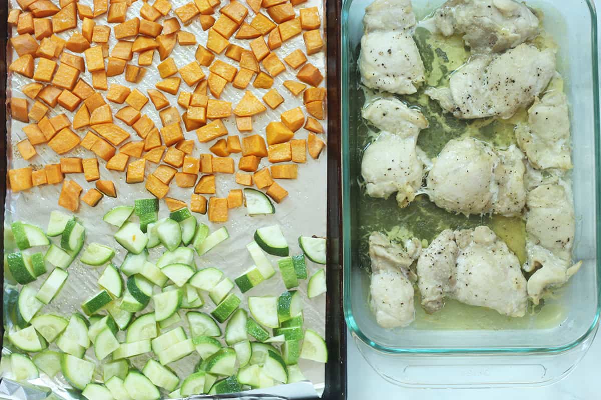 roasted sweet potato, zucchini and chicken on pans.