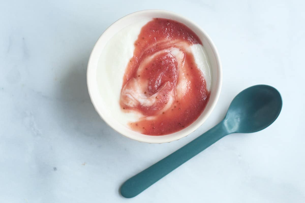 yogurt and fruit puree swirl in bowl