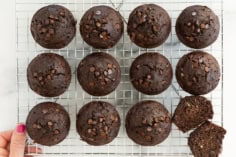 Chocolate chip zucchini muffins on cooling rack.