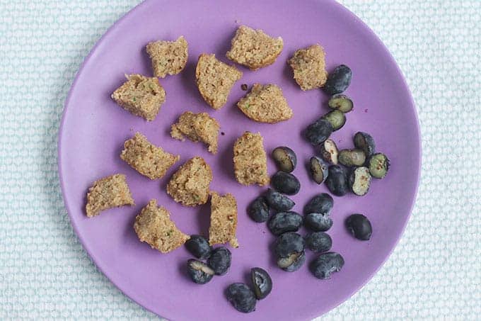diced zucchini muffin on purple plate.