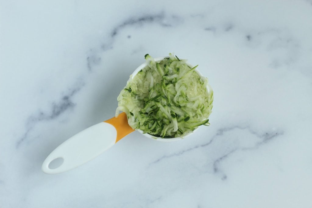 Zucchini in measuring cup.