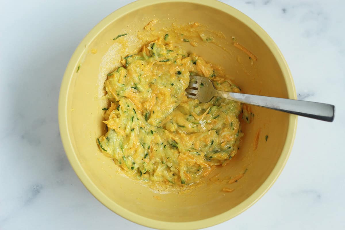 Egg cup mixture in yellow bowl.