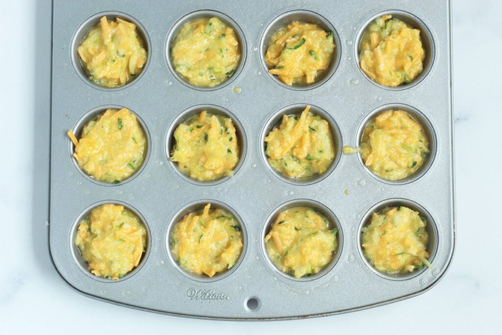 Egg cups in mini muffin pan before baking.