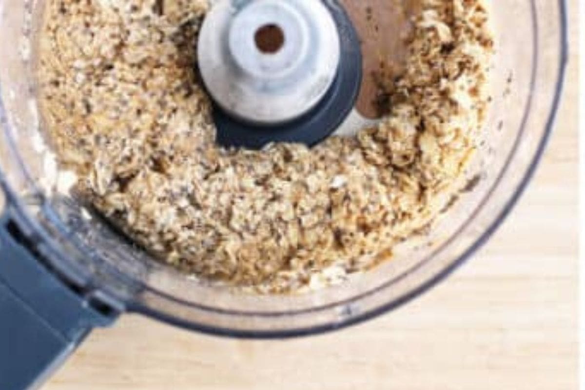 Mixture for homemade granola bars in food processor. 