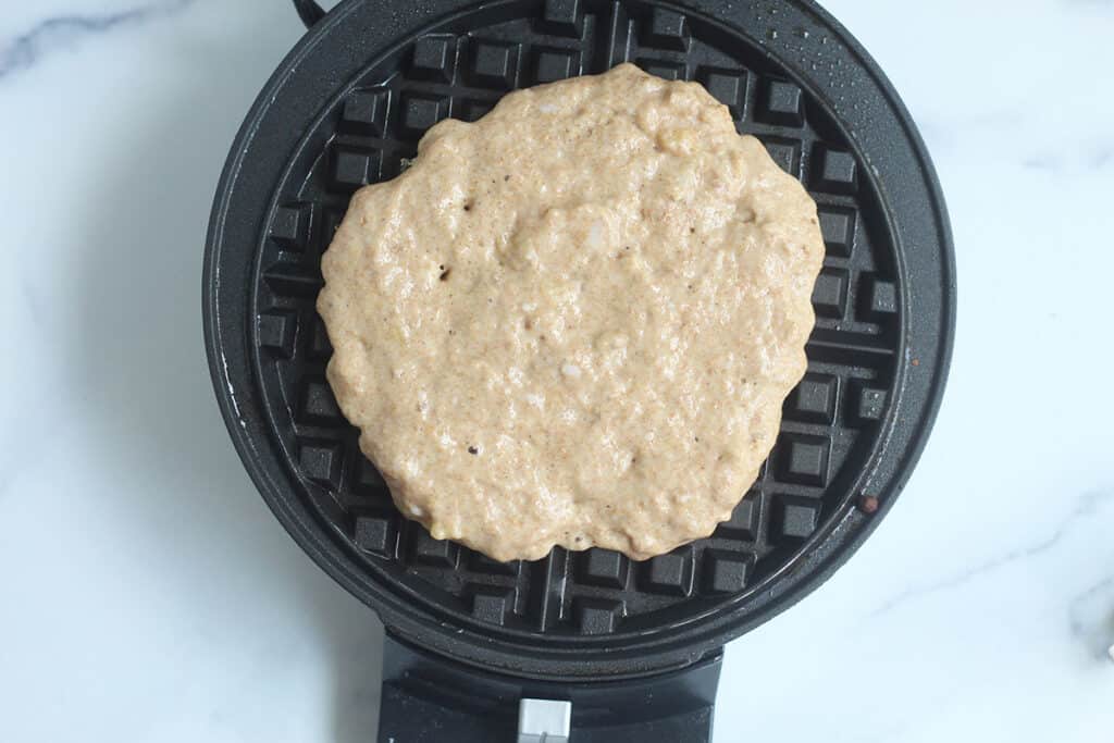 banana waffle batter on waffle iron.