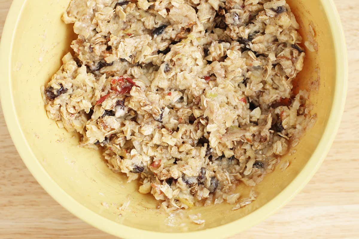 batter for apple oatmeal cookies in yellow bowl.