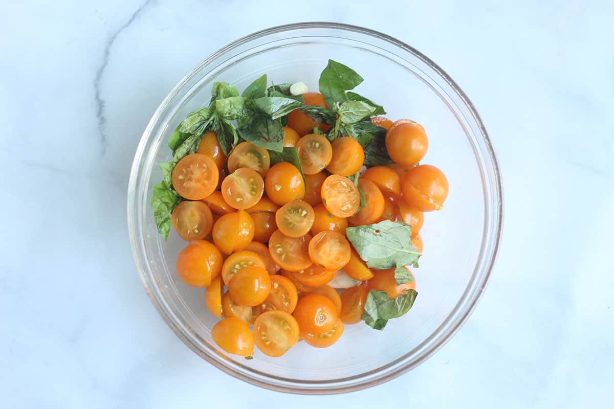 ingredients for cherry tomato sauce in bowl.