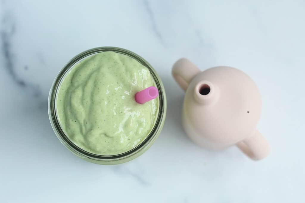 green pregnancy smoothie in jar with kids cup