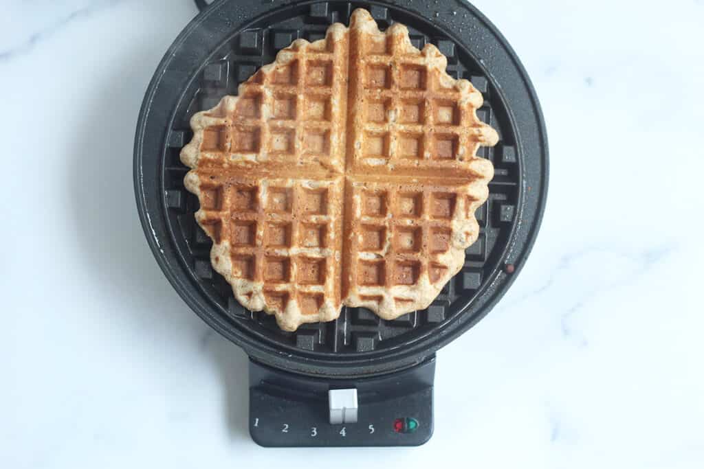 cooked banana waffle on waffle maker.