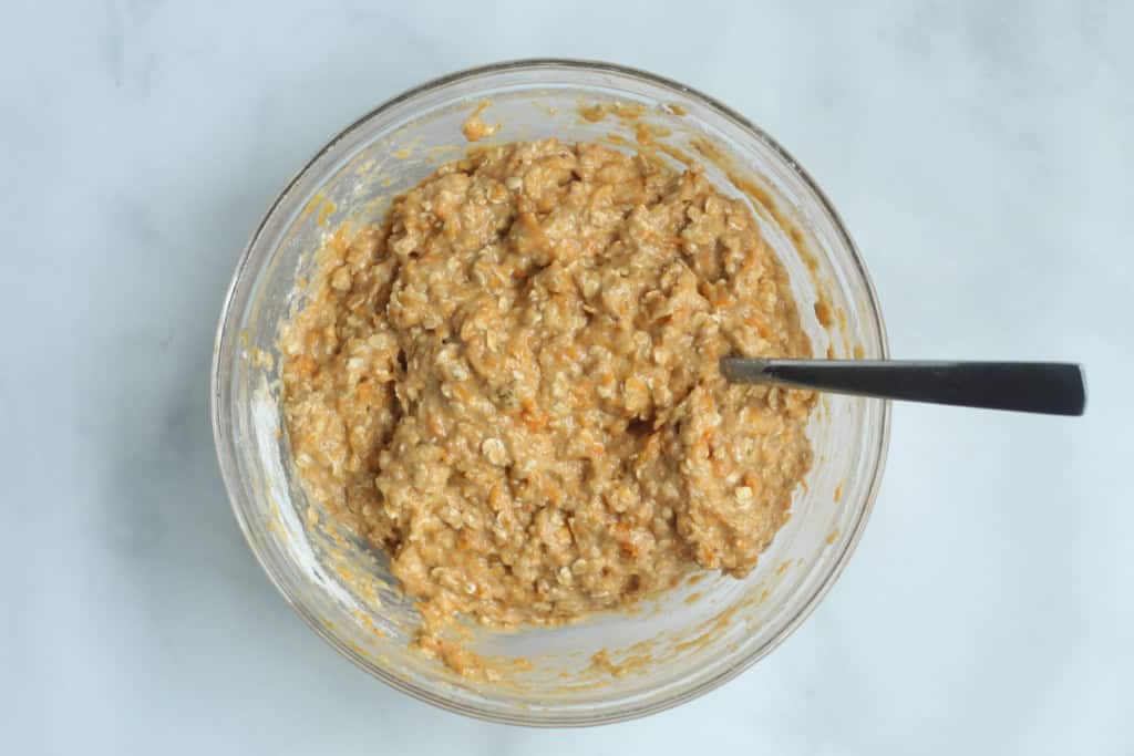 Squash muffins batter in glass bowl.