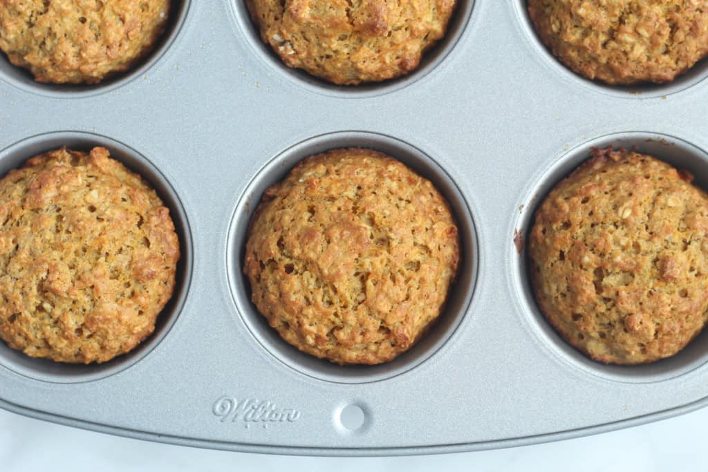 Butternut squash muffins in muffin pan after baking.