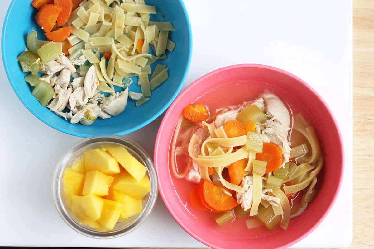 noodle soup in kids bowls