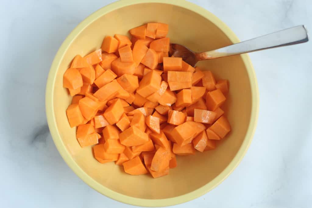 Sweet potatoes chopped in a bowl for roasted sweet potatoes.
