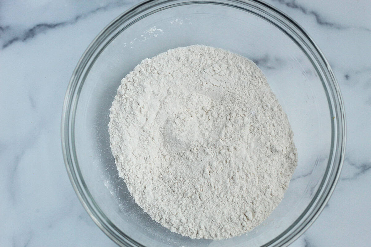 Dry ingredients for christmas cookies in glass bowl. 