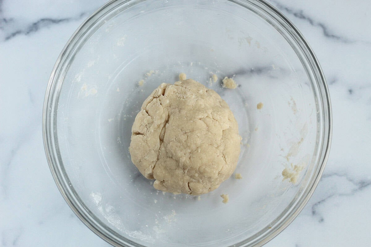 Dough for christmas cookies in glass bowl.