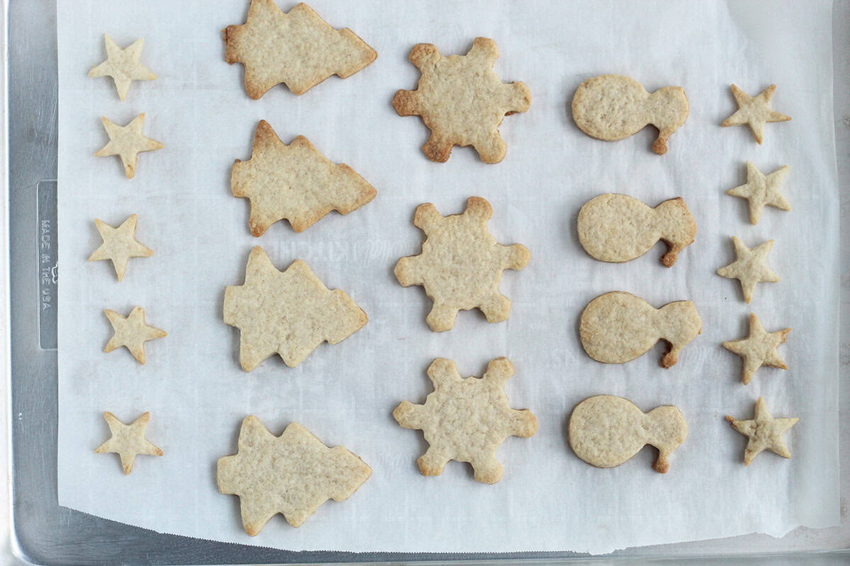 Christmas cookies on parchment paper after baking. 