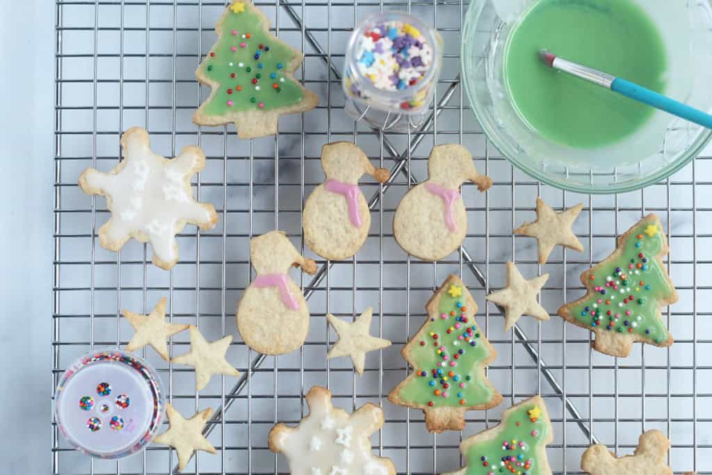 Decorating christmas cookies with frosting.