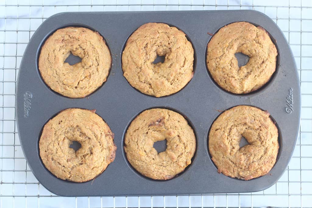 Sweet potato donuts in donut pan after baking.