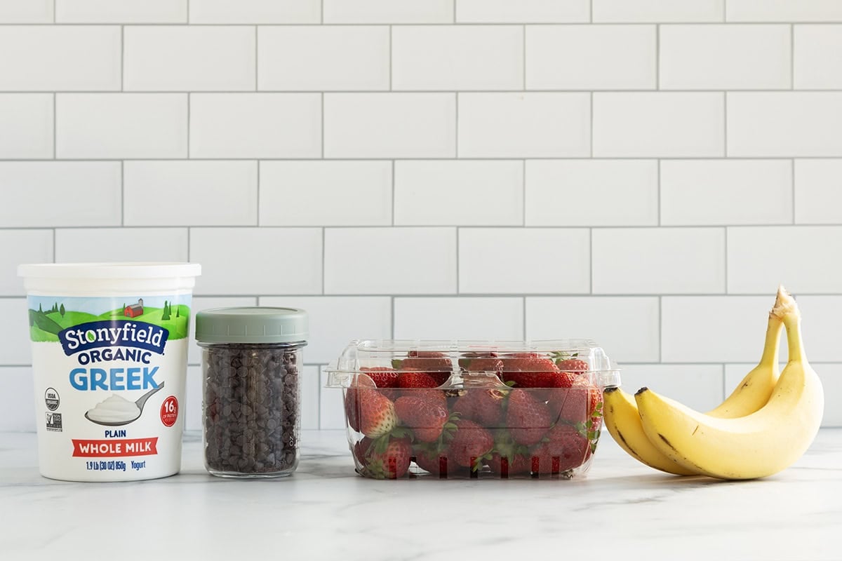Ingredients for strawberry santas on countertop.