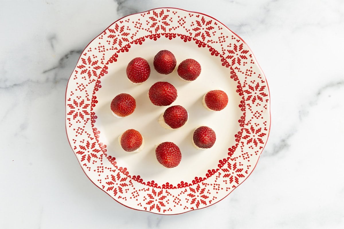 Strawberries on top of banana slices on plate for santas.