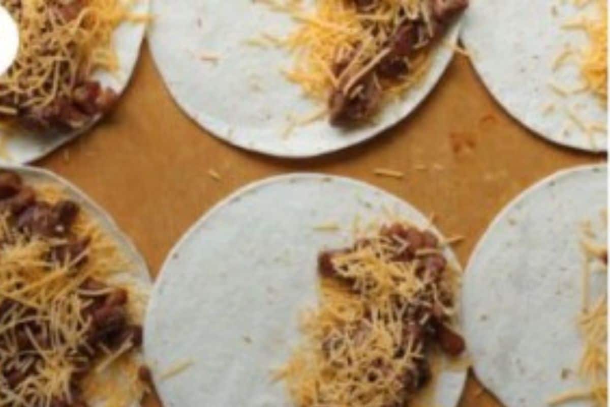 Making vegetarian quesadillas on a cutting board. 