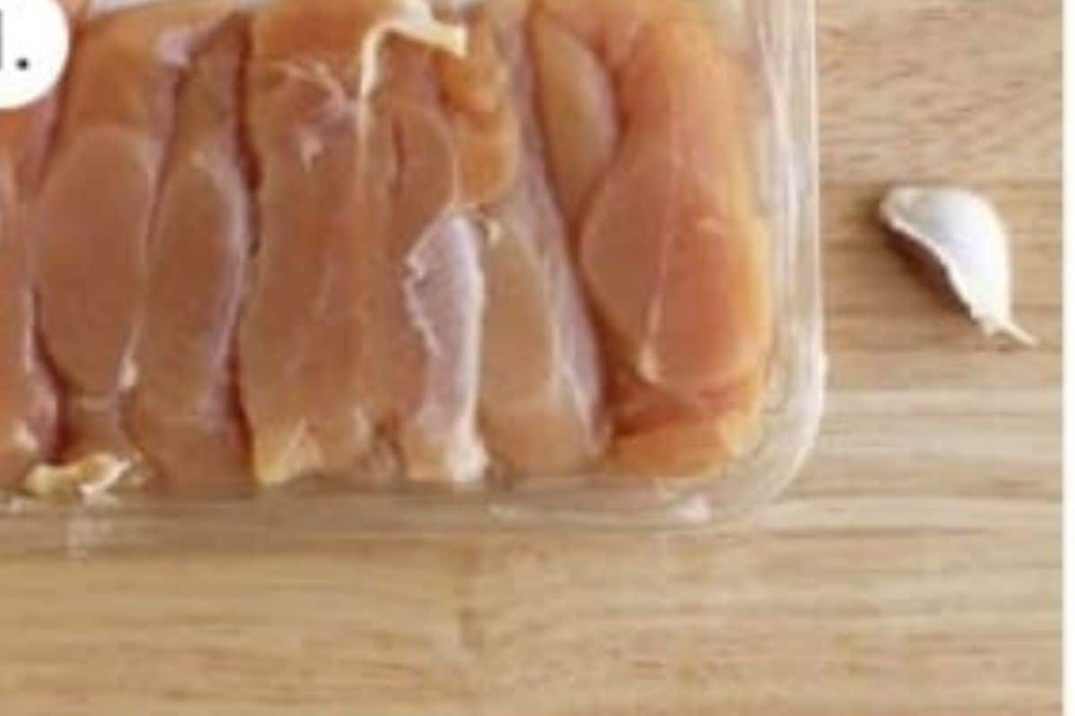 Chicken and garlic on countertop for pan seared chicken. 