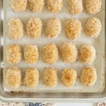 Chicken nuggets on baking sheet after cooking.