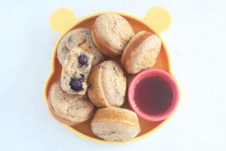 pancake-muffins-on-yellow-plate-with-syrup