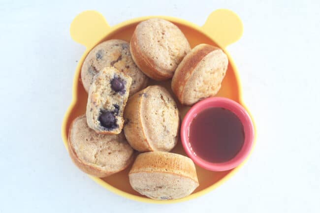 pancake-muffins-on-yellow-plate-with-syrup