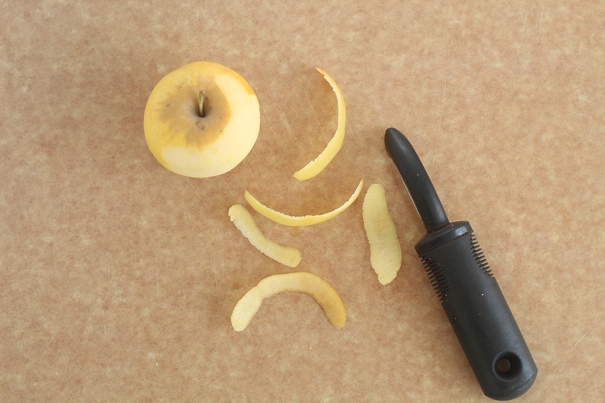 peeled apple on cutting board