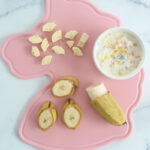 bananas-on-pink-cutting-board