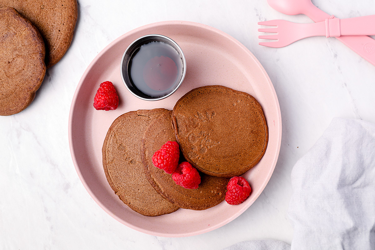 chocolate pancakes on pink plate
