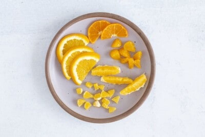 oranges for baby on purple plate