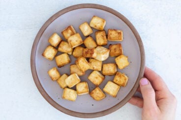 baked tofu on purple plate.