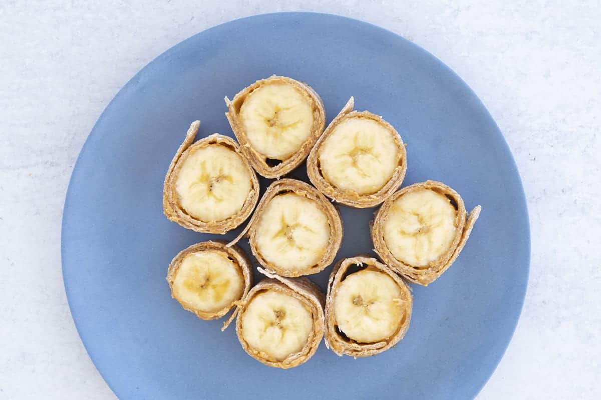banana sushi on blue plate