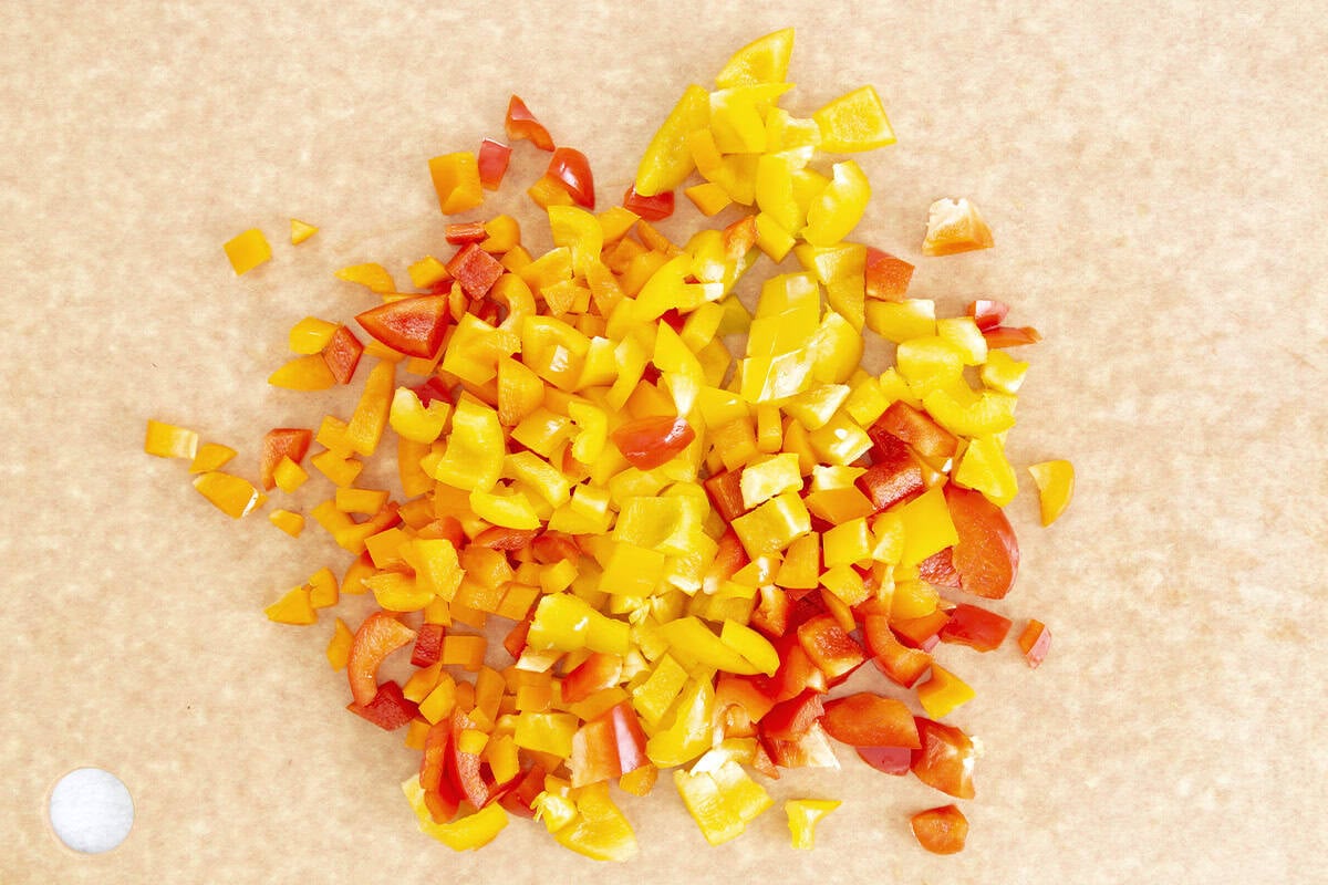 diced bell peppers on cutting board.
