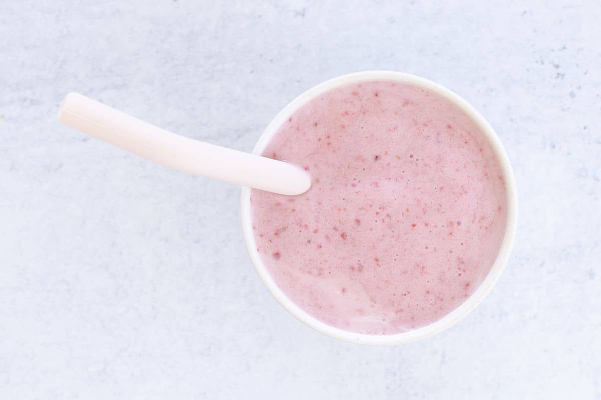 strawberry yogurt smoothie with pink straw