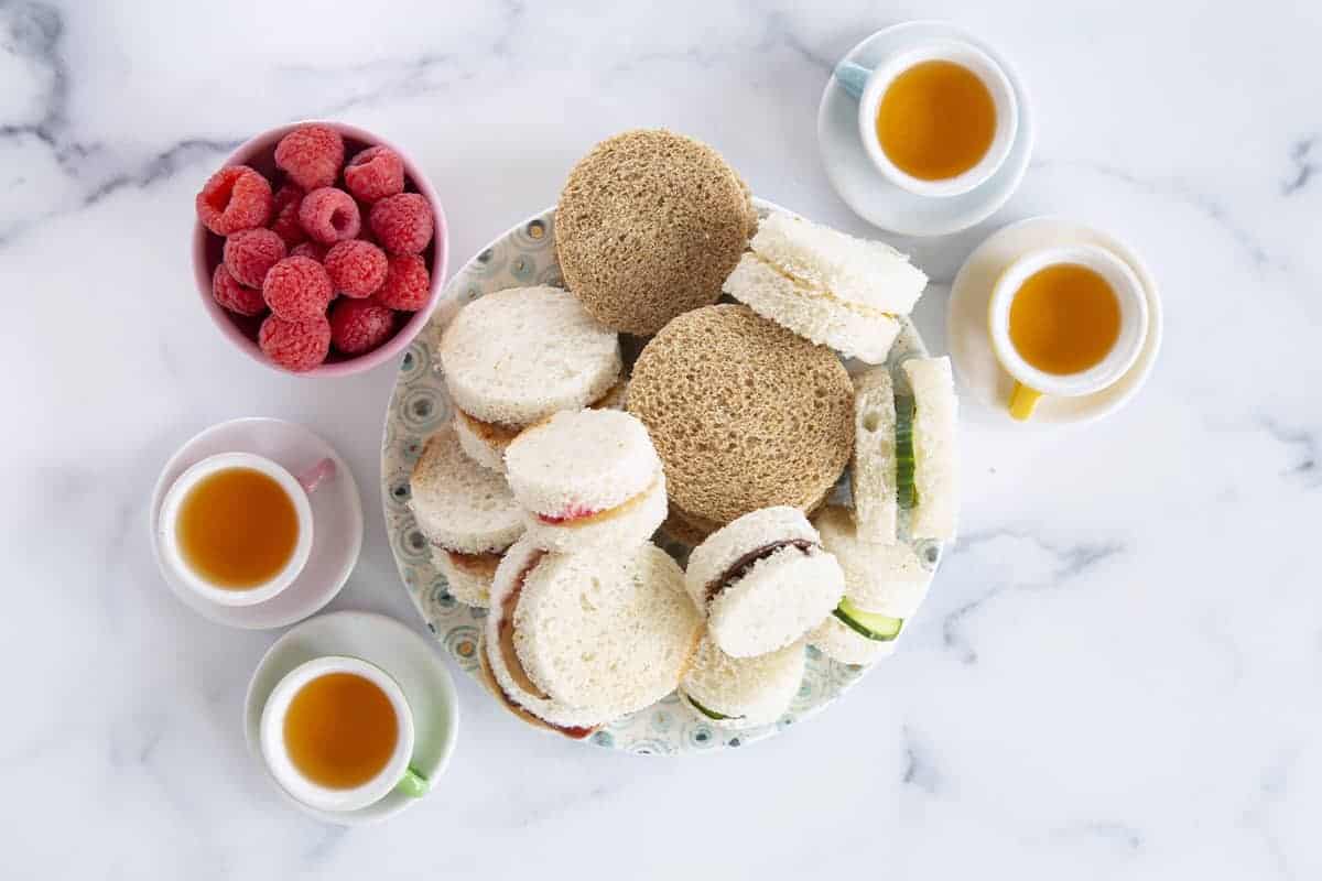 tea sandwiches for kids with tea and raspberries
