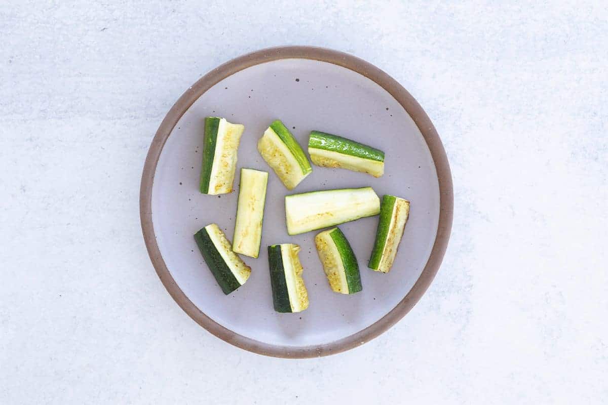 baby led weaning style zucchini sticks on plate