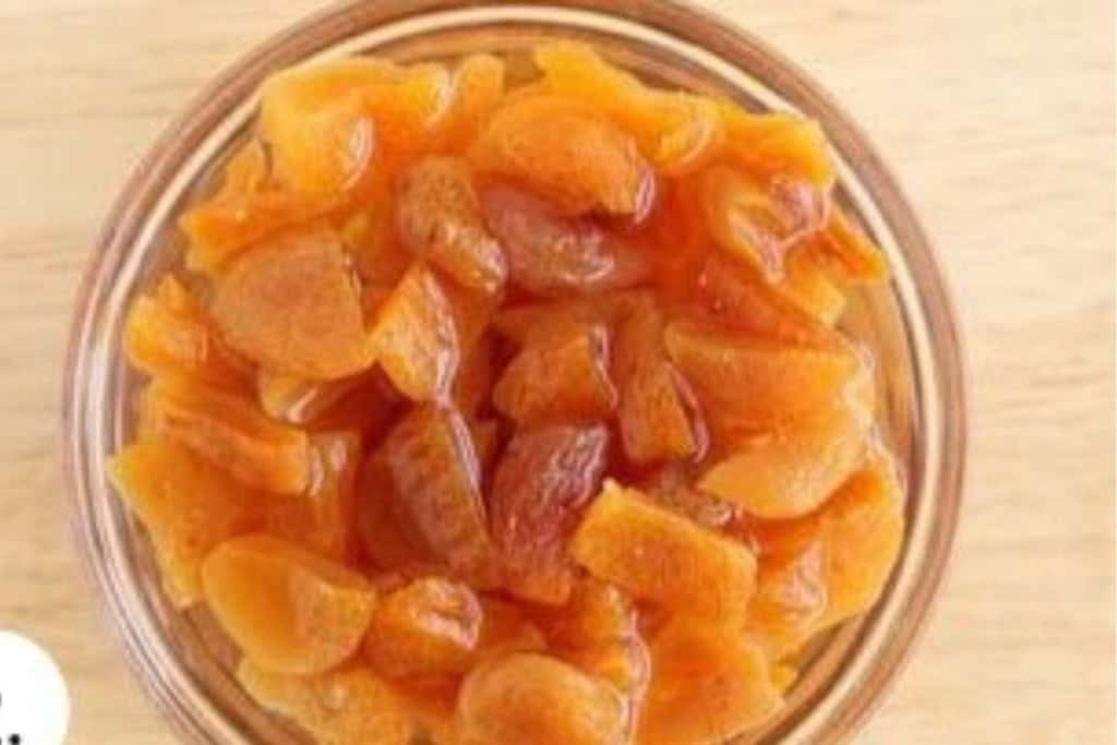Apricots soaking in water for granola bites.