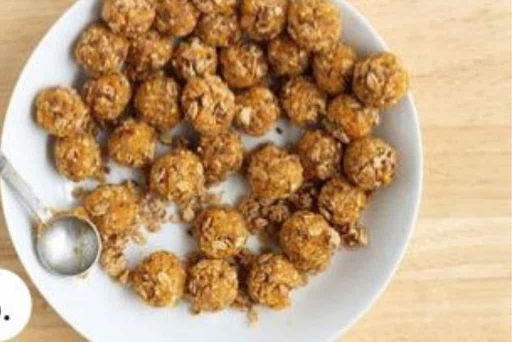 Making granola bites on white plate.