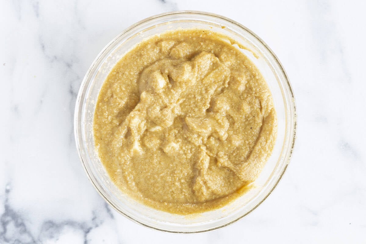 Batter for almond flour muffins in glass bowl.