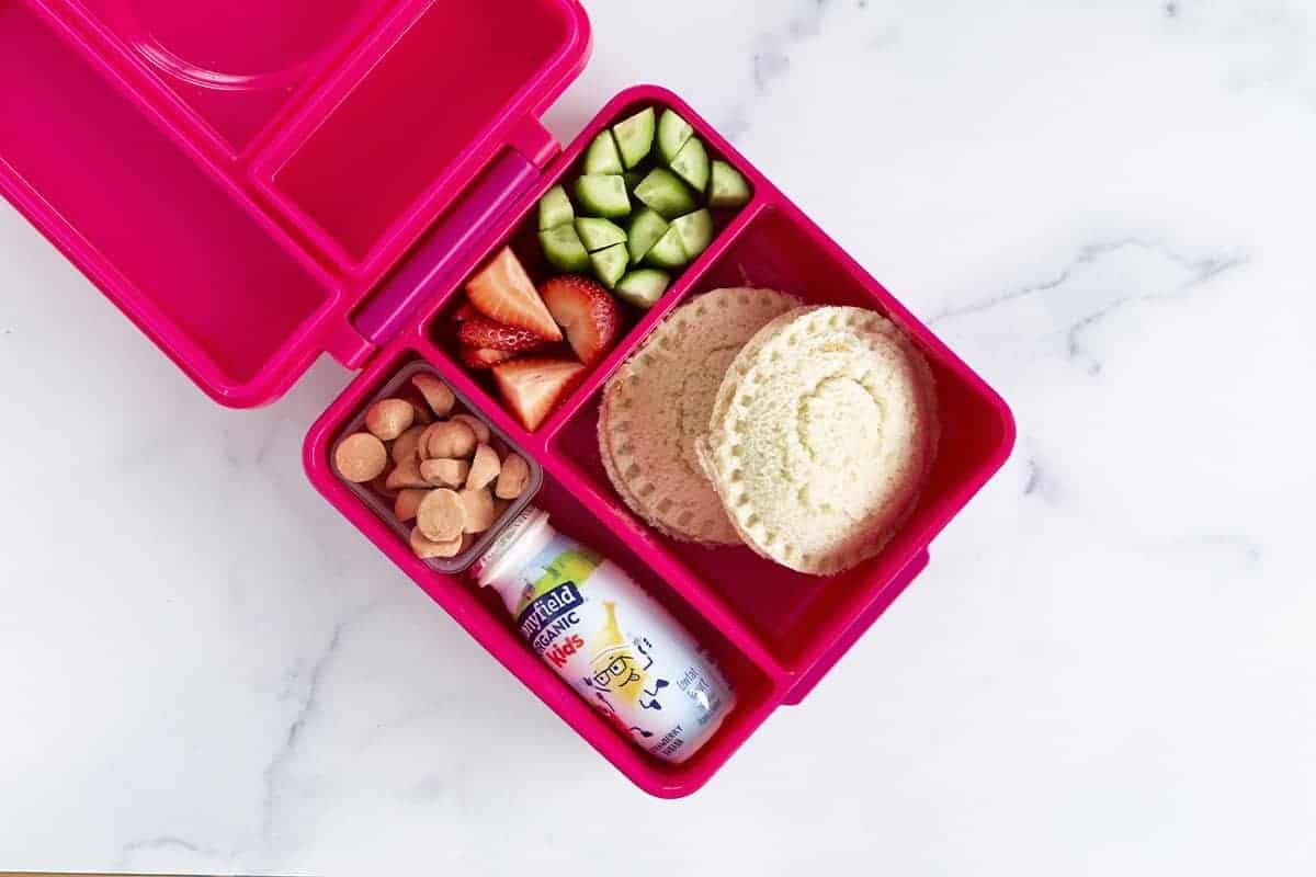 uncrustables in pink lunchbox.